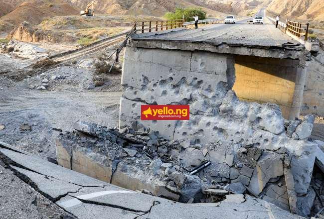 A heavily-damaged bridge which was hit by a US strike is pictured along the road connecting Roudan and Bandar Abbas in southern Iran on July 18, 2026. (Photo by AMIR HOSSEIN KHORGOOEI / ISNA / AFP)