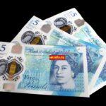 British £5 pound sterling banknotes fanned out on black background — GBP to naira exchange rate guide