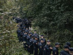 Police officers at the Porokhovskoye cemetery, where the press service owned by Yevgeny Prigozhin said he was buried, in St. Petersburg, Russia, on Aug. 29. The announcement of the burial of the Russian mercenary chief who died in a plane crash ended days of speculation over how he would be laid to rest.